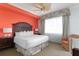Well-lit bedroom offers a king bed, ceiling fan, and colorful accents at 5804 Palmetto Dr # A-401/403, Isle of Palms, SC 29451