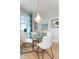 Dining area with a glass table and view of bedroom at 5804 Palmetto Dr # A-401/403, Isle of Palms, SC 29451