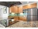 Kitchen with stainless appliances, granite counters, and a vibrant backsplash at 5804 Palmetto Dr # A-401/403, Isle of Palms, SC 29451