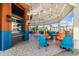 Outdoor dining area with colorful seating, a vaulted ceiling, and views of the surrounding landscape at 5804 Palmetto Dr # A-401/403, Isle of Palms, SC 29451