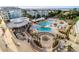 Resort-style pool with lounging areas, firepit, and ocean views, perfect for relaxation and entertainment at 5804 Palmetto Dr # A-401/403, Isle of Palms, SC 29451
