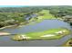 Scenic aerial view of an island golf course, water and beautiful landscaping at 619 Magnolia Walk Villas, Edisto Island, SC 29438
