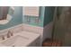 Well-lit bathroom with updated vanity, modern fixtures, and a new tiled shower at 619 Magnolia Walk Villas, Edisto Island, SC 29438