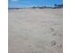 Expansive sandy beach on a clear day, perfect for relaxation and recreation at 619 Magnolia Walk Villas, Edisto Island, SC 29438