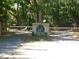 Gated community entrance nestled among trees and lush foliage at 619 Magnolia Walk Villas, Edisto Island, SC 29438