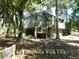 Inviting villa featuring a raised foundation, charming exterior and ample natural light at 619 Magnolia Walk Villas, Edisto Island, SC 29438