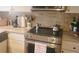 Modern kitchen with stainless steel appliances and granite countertops provides an elegant cooking space at 619 Magnolia Walk Villas, Edisto Island, SC 29438