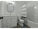 Clean bathroom featuring shower and vanity with a round mirror at 637 N Laurel St # 75, Summerville, SC 29483