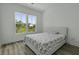 A bedroom with two windows and hardwood floors at 637 N Laurel St # 75, Summerville, SC 29483