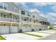 Exterior view of townhomes with attached garages, balconies, and modern architectural design at 637 N Laurel St # 75, Summerville, SC 29483