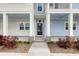 Inviting front entrance with a charming porch and well-manicured landscaping at 637 N Laurel St # 75, Summerville, SC 29483