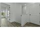 Bright hallway featuring wood floors and white doors at 637 N Laurel St # 75, Summerville, SC 29483