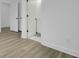 Bright bathroom entrance with luxury plank flooring, sleek white trim, and classic black hardware at 637 N Laurel St # 75, Summerville, SC 29483