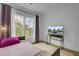 Cozy bedroom with a TV, rug, curtains, and a window offering an inviting view at 637 N Laurel St # 75, Summerville, SC 29483