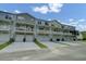 Townhome exteriors with garages and balconies offer a blend of style and functionality at 637 N Laurel St # 75, Summerville, SC 29483