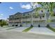 Charming townhomes feature private balconies, individual garages, and well-maintained landscaping at 637 N Laurel St # 75, Summerville, SC 29483