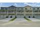 Townhome complex with attached garages and well-manicured lawns enhances curb appeal at 637 N Laurel St # 75, Summerville, SC 29483