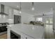 An open kitchen featuring pendant lights, stainless appliances, a large island, and a view to living room at 637 N Laurel St # 75, Summerville, SC 29483