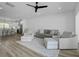 Spacious living room featuring hardwood floors and modern furniture, with adjoining kitchen at 637 N Laurel St # 75, Summerville, SC 29483