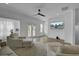 Bright living room with hardwood floors, ceiling fan, and large tv, with neutral furniture at 637 N Laurel St # 75, Summerville, SC 29483