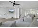 Open-concept living space featuring hardwood floors, a modern ceiling fan, and a spacious layout at 637 N Laurel St # 75, Summerville, SC 29483