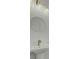 The powder room has an oval mirror, a pedestal sink, and a brass faucet at 637 N Laurel St # 75, Summerville, SC 29483