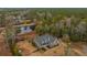 House nestled in a wooded area, near a pond and other homes at 788 Awendaw Lakes Blvd, Awendaw, SC 29429