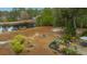 Large backyard with fire pit, landscaping, and patio seating at 788 Awendaw Lakes Blvd, Awendaw, SC 29429