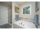 Spa-like bathroom with soaking tub, shower, and updated fixtures at 788 Awendaw Lakes Blvd, Awendaw, SC 29429