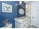 Double vanity bathroom with granite countertop and blue walls at 788 Awendaw Lakes Blvd, Awendaw, SC 29429