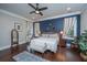 Spacious main bedroom with a king-size bed and a blue accent wall at 788 Awendaw Lakes Blvd, Awendaw, SC 29429