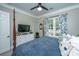 Relaxing bedroom with a comfortable bed and large window at 788 Awendaw Lakes Blvd, Awendaw, SC 29429