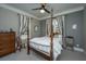Spacious bedroom with a post bed and plenty of natural light at 788 Awendaw Lakes Blvd, Awendaw, SC 29429