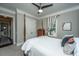 Charming bedroom with a post bed, dresser, and window at 788 Awendaw Lakes Blvd, Awendaw, SC 29429