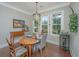 Spacious dining area with hardwood floors and large windows at 788 Awendaw Lakes Blvd, Awendaw, SC 29429