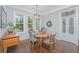 Charming dining room with hardwood floors and elegant chandelier at 788 Awendaw Lakes Blvd, Awendaw, SC 29429