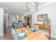 Bright dining room with hardwood floors and a charming wooden table at 788 Awendaw Lakes Blvd, Awendaw, SC 29429