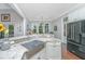 Modern kitchen with farmhouse sink, granite countertops, and stainless steel appliances at 788 Awendaw Lakes Blvd, Awendaw, SC 29429