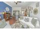 Spacious living room featuring hardwood floors, comfortable sofas, and stylish decor at 788 Awendaw Lakes Blvd, Awendaw, SC 29429