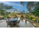 Outdoor patio with dining set and umbrella, ideal for entertaining at 788 Awendaw Lakes Blvd, Awendaw, SC 29429