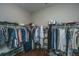 Spacious walk-in closet with double hanging rods and drawers at 788 Awendaw Lakes Blvd, Awendaw, SC 29429