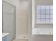Bathroom with shower and jetted bathtub at 7897 Sabalridge Dr, North Charleston, SC 29418