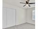 Bedroom with double-door closet and ceiling fan at 7897 Sabalridge Dr, North Charleston, SC 29418