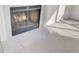 Elegant marble fireplace with a fire burning at 7897 Sabalridge Dr, North Charleston, SC 29418