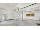 Spacious two-car garage with extra storage cabinets and ceiling fans at 7897 Sabalridge Dr, North Charleston, SC 29418