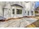 Large concrete patio with brick accents, adjacent to the house at 7897 Sabalridge Dr, North Charleston, SC 29418