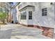 Rear patio with brick steps and access to the house and yard at 7897 Sabalridge Dr, North Charleston, SC 29418
