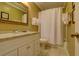Clean bathroom with granite countertop and white vanity at 8000 Palmetto Dr # 505, Isle of Palms, SC 29451