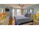 Bedroom with queen bed, dresser, and ocean view at 8000 Palmetto Dr # 505, Isle of Palms, SC 29451