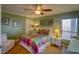 Bright bedroom with colorful bedding and hardwood floors at 8000 Palmetto Dr # 505, Isle of Palms, SC 29451
